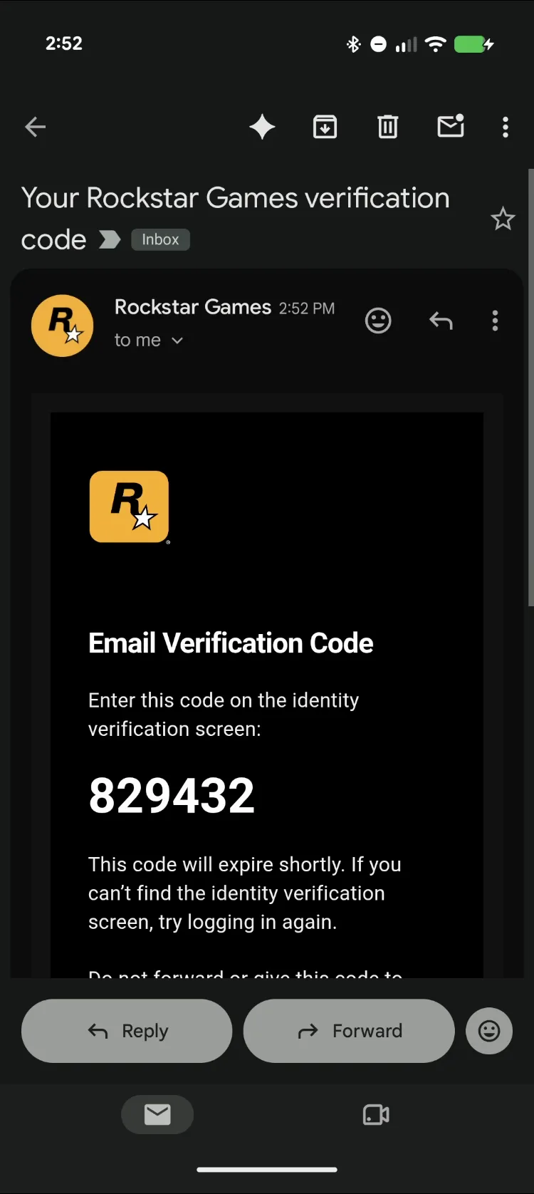 Phone showing Rockstar Games' Email Verification Code e-mail with the six-digit code